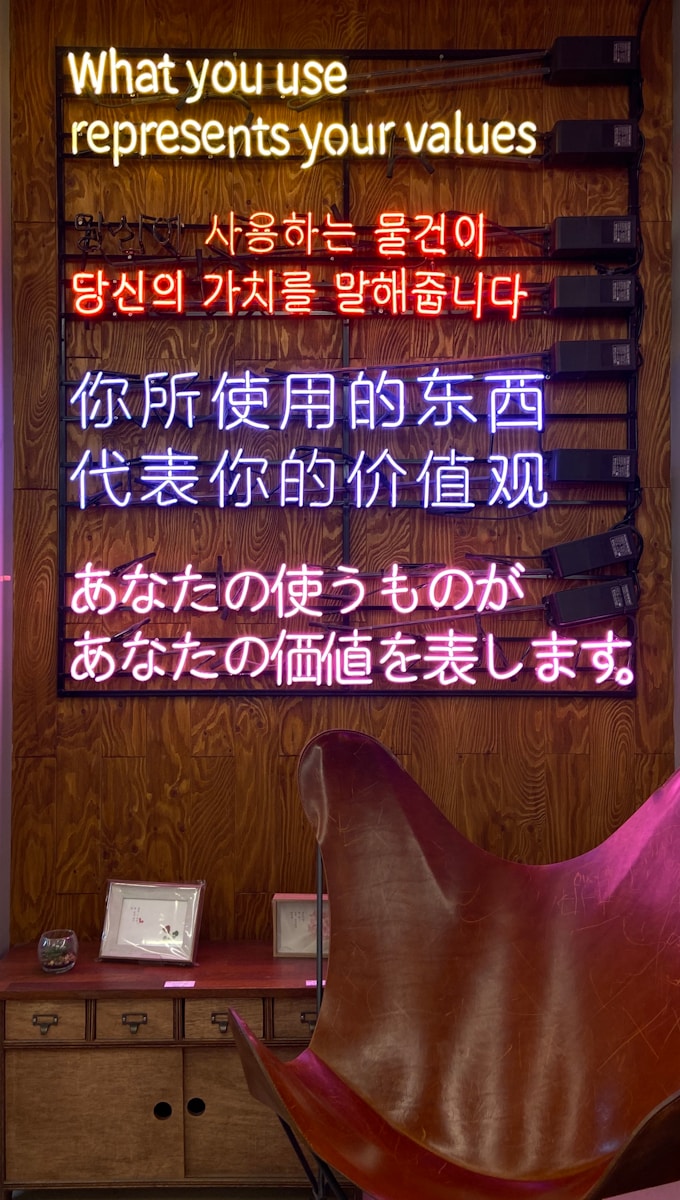 Photo by e a room with a chair and a sign that says what you use represents your values